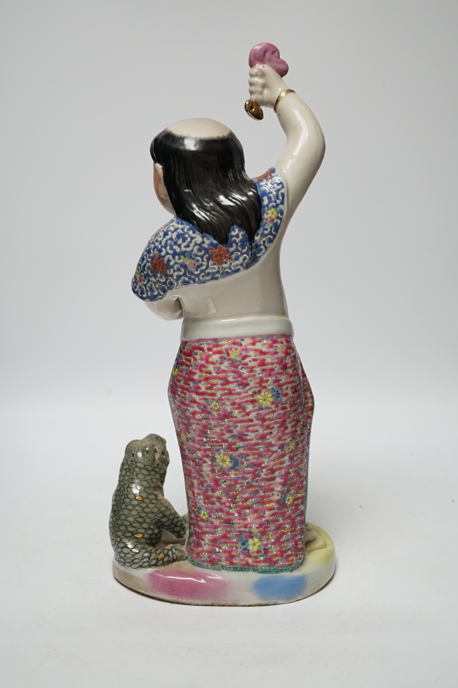 A Chinese famille rose porcelain figure of Liu Hai, stamp to base, 39cm